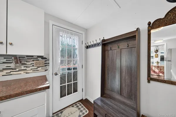 a view of a kitchen from the hallway