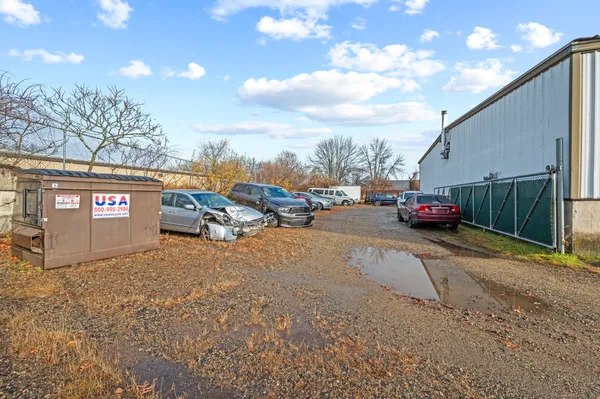 a view of a garage with parked cars