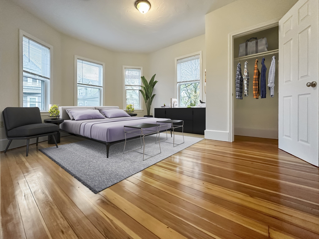 55 Hollander Street, Unit 2 Boston, MA 02121 - Photo 3 of 8 a living room with furniture and wooden floor
