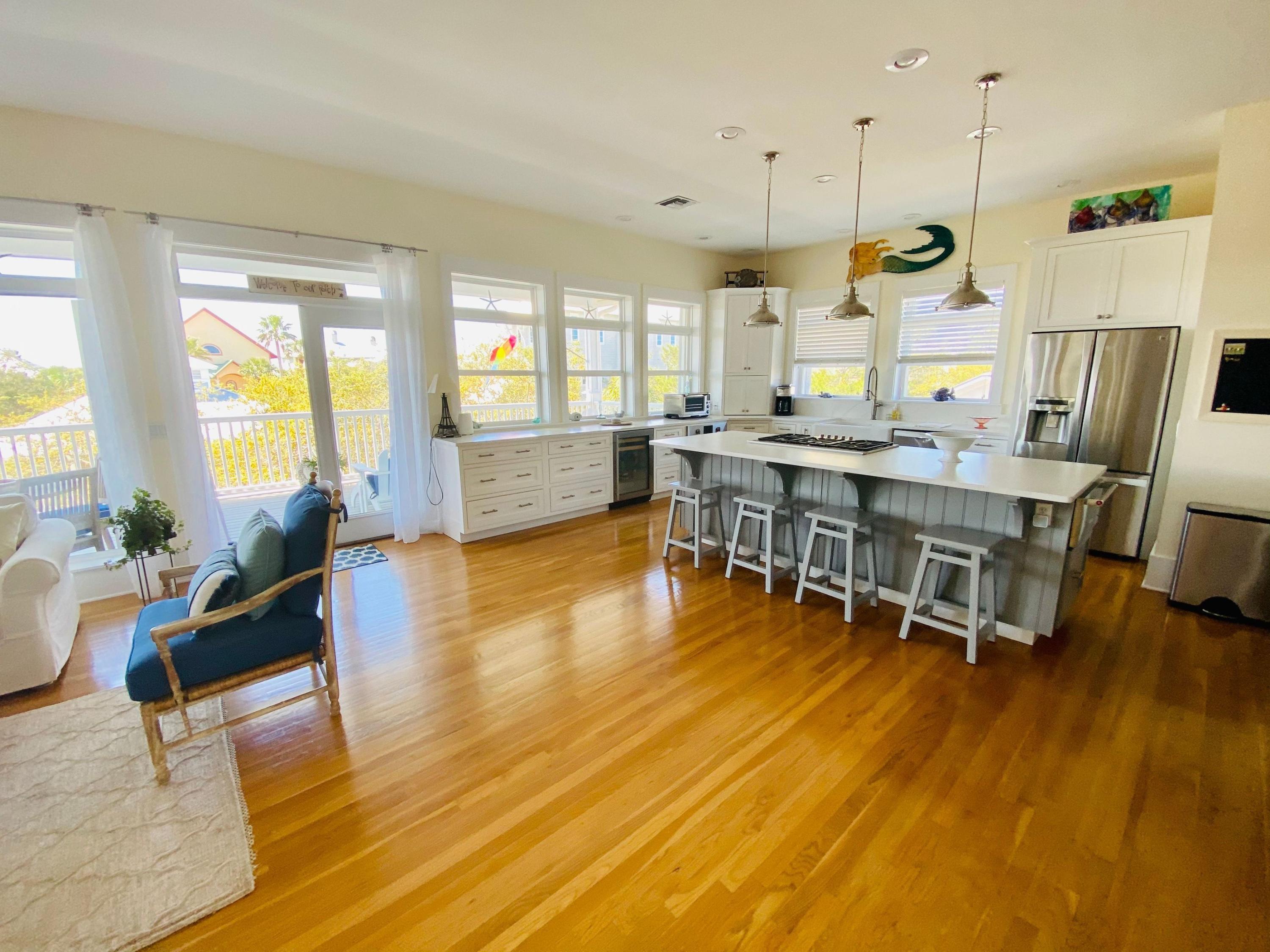 170 Old Beach Road Santa Rosa Beach, FL 32459 - Photo 1 of 35 a view of a dining room with furniture and wooden floor