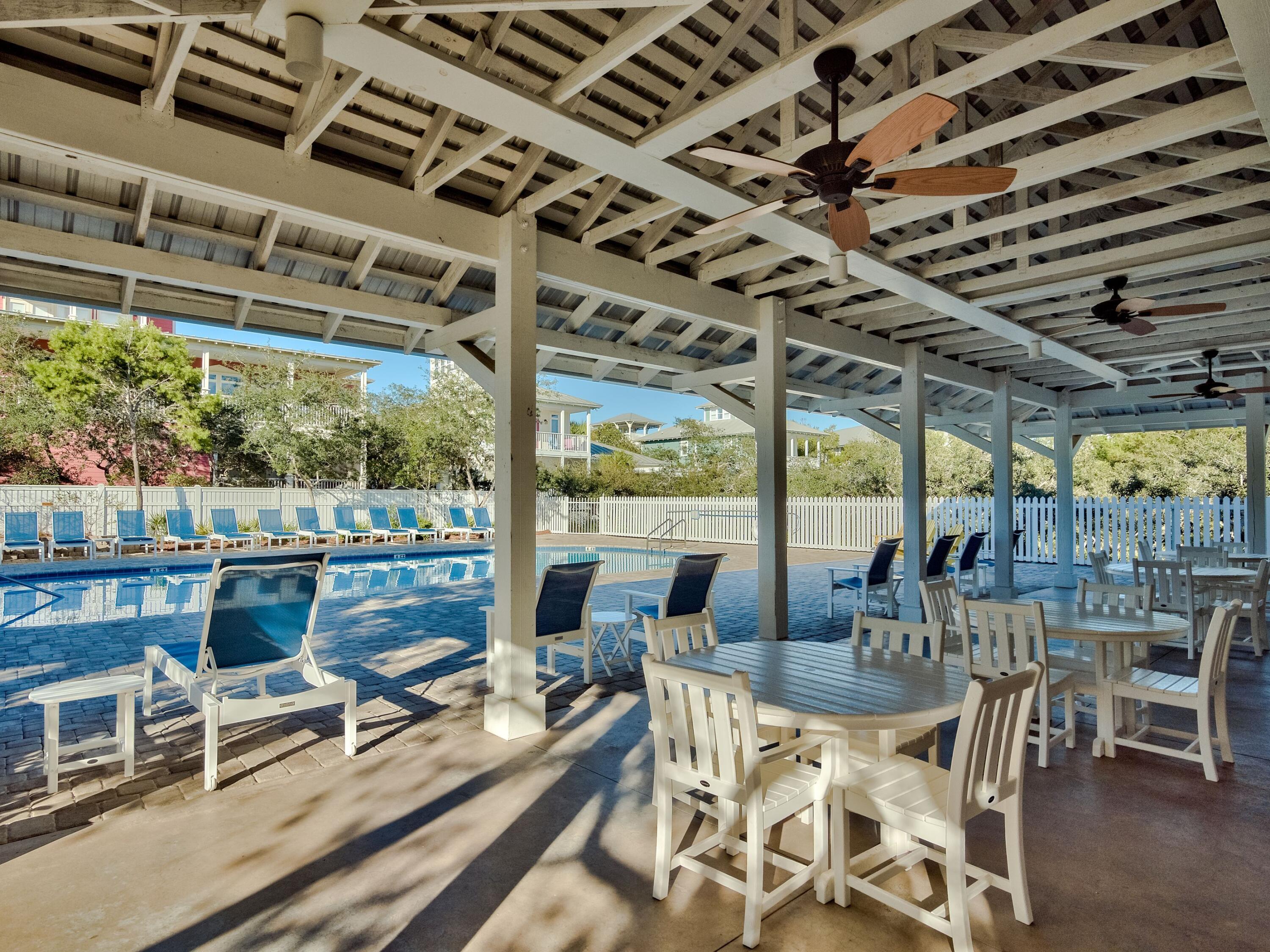 170 Old Beach Road Santa Rosa Beach, FL 32459 - Photo 24 of 35 a view of a chairs and table in a patio
