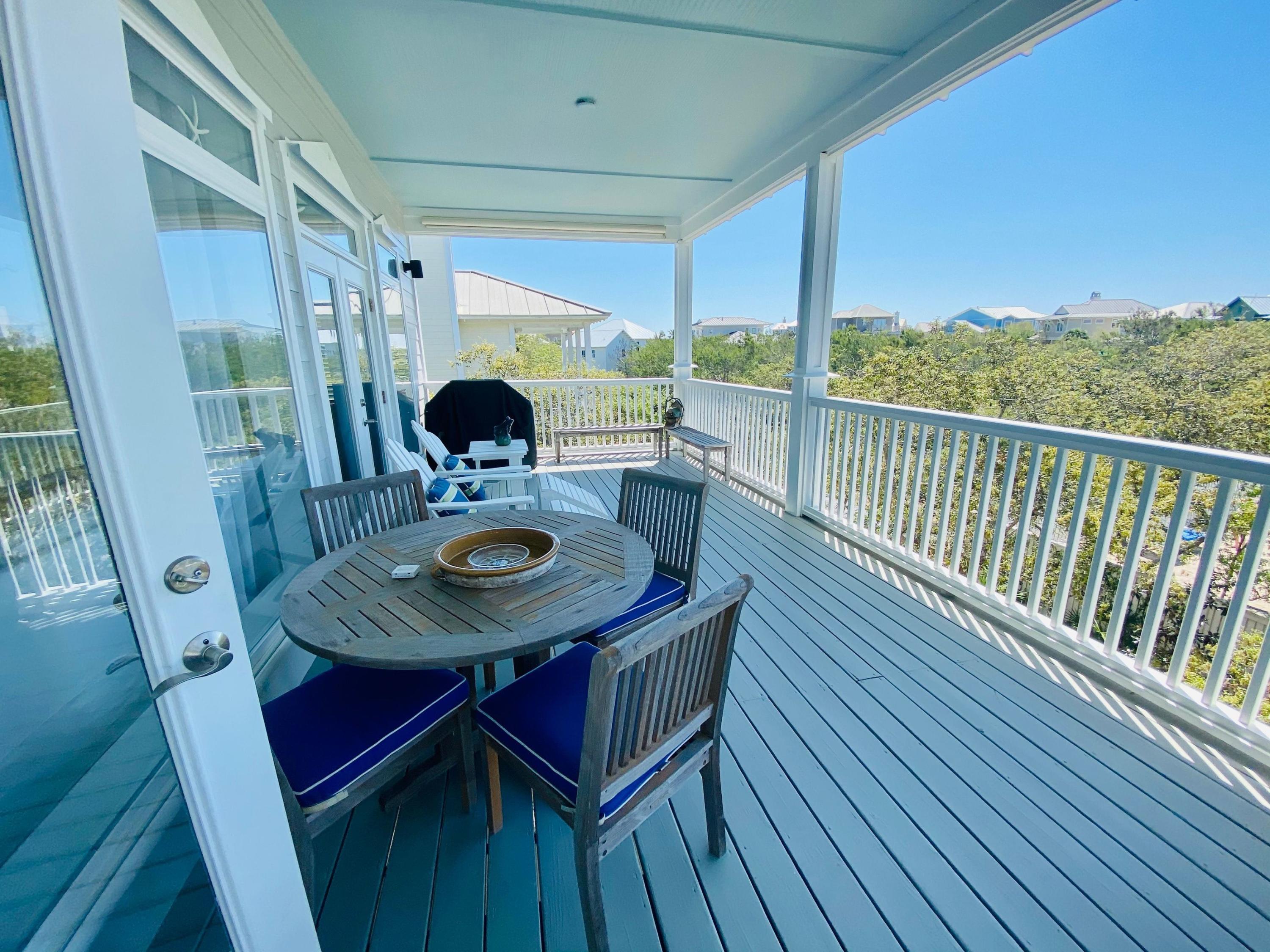 170 Old Beach Road Santa Rosa Beach, FL 32459 - Photo 9 of 35 a balcony with table and chairs