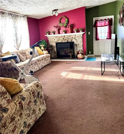 a bedroom with a bed couch and a window