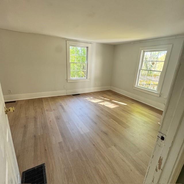 2344 Ripplewater Drive Southeast Atlanta, GA 30316 - Photo 12 of 18 a view of an empty room with a window and wooden floor