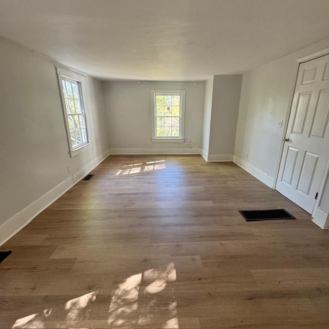 2344 Ripplewater Drive Southeast Atlanta, GA 30316 - Photo 13 of 18 a view of an empty room with wooden floor and a window
