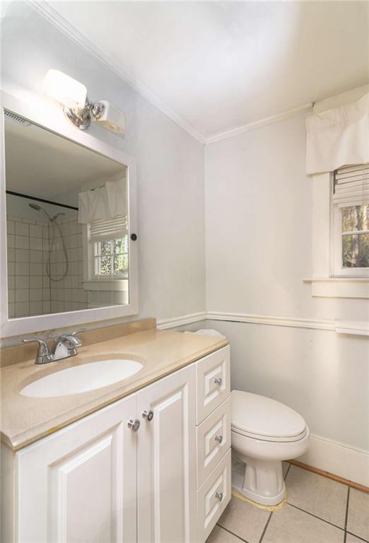 2344 Ripplewater Drive Southeast Atlanta, GA 30316 - Photo 15 of 18 a bathroom with a granite countertop toilet sink and mirror