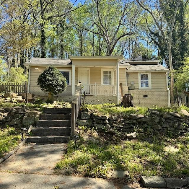 2344 Ripplewater Drive Southeast Atlanta, GA 30316 - Photo 2 of 18 front view of a house with a yard