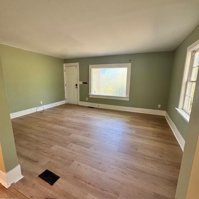 2344 Ripplewater Drive Southeast Atlanta, GA 30316 - Photo 3 of 18 an empty room with wooden floor and windows
