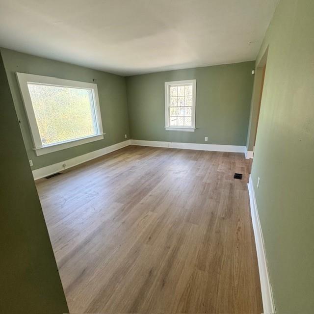 2344 Ripplewater Drive Southeast Atlanta, GA 30316 - Photo 5 of 18 a view of an empty room with wooden floor and a window