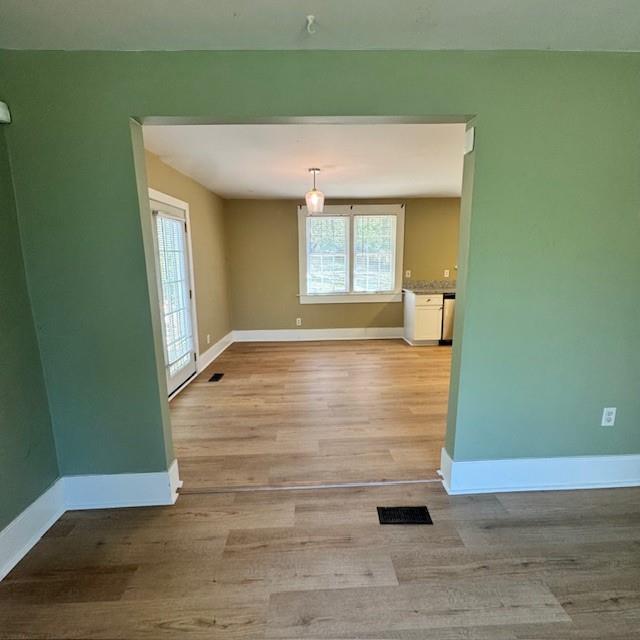 2344 Ripplewater Drive Southeast Atlanta, GA 30316 - Photo 6 of 18 an empty room with wooden floor and windows