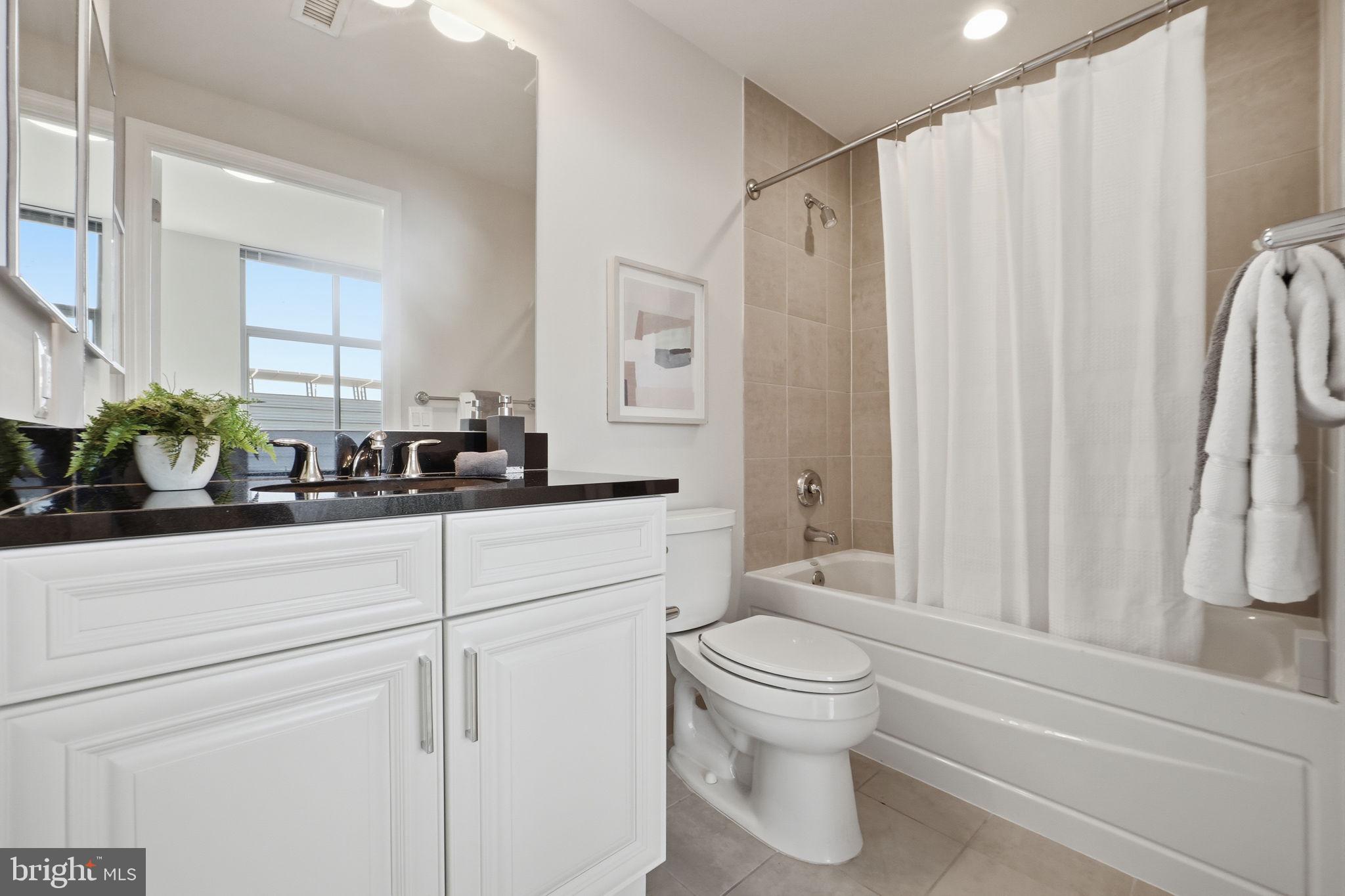 11990 Market Street, Unit 2103 Reston, VA 20190 - Photo 41 of 78 Modern bathroom with sleek finishes.