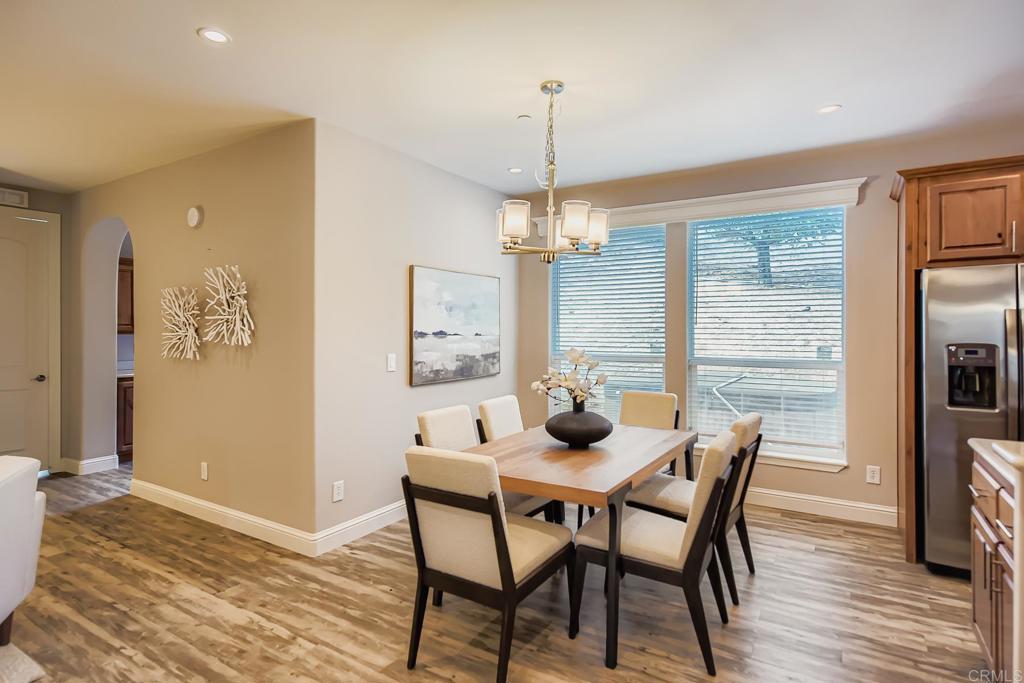 28720 North Twin Oaks Valley Road Vista, CA 92084 - Photo 15 of 66 a view of a dining room with furniture window and wooden floor