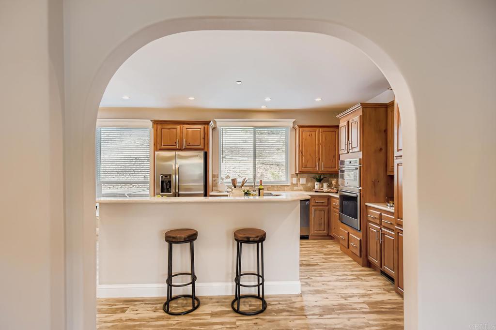 28720 North Twin Oaks Valley Road Vista, CA 92084 - Photo 20 of 66 a kitchen with stainless steel appliances granite countertop a stove and cabinets