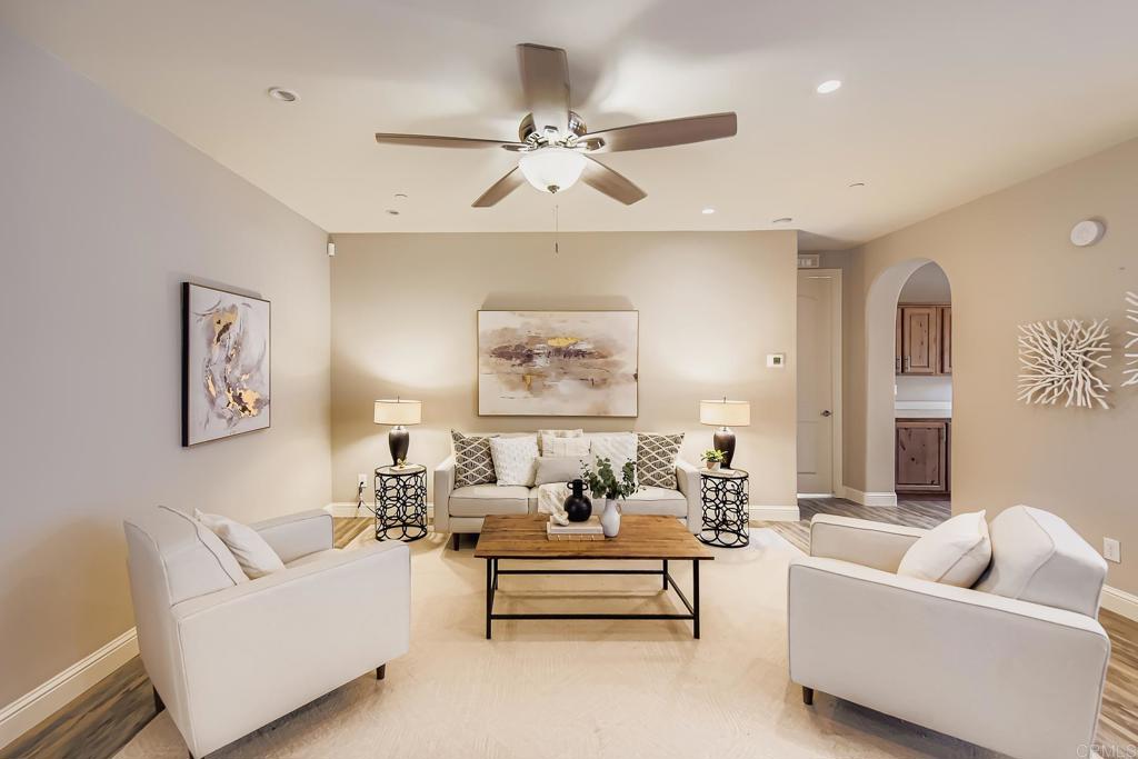 28720 North Twin Oaks Valley Road Vista, CA 92084 - Photo 23 of 66 a living room with furniture and a chandelier
