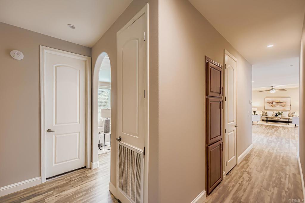 28720 North Twin Oaks Valley Road Vista, CA 92084 - Photo 24 of 66 a view of a hallway with wooden floor and a cabinet