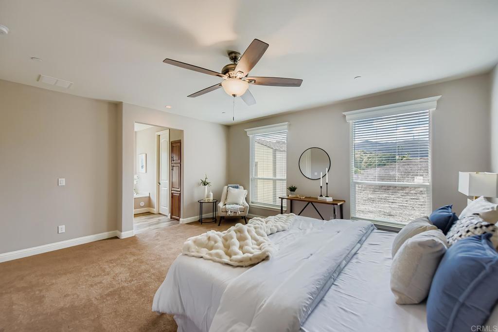 28720 North Twin Oaks Valley Road Vista, CA 92084 - Photo 26 of 66 a bedroom with a bed and a large window