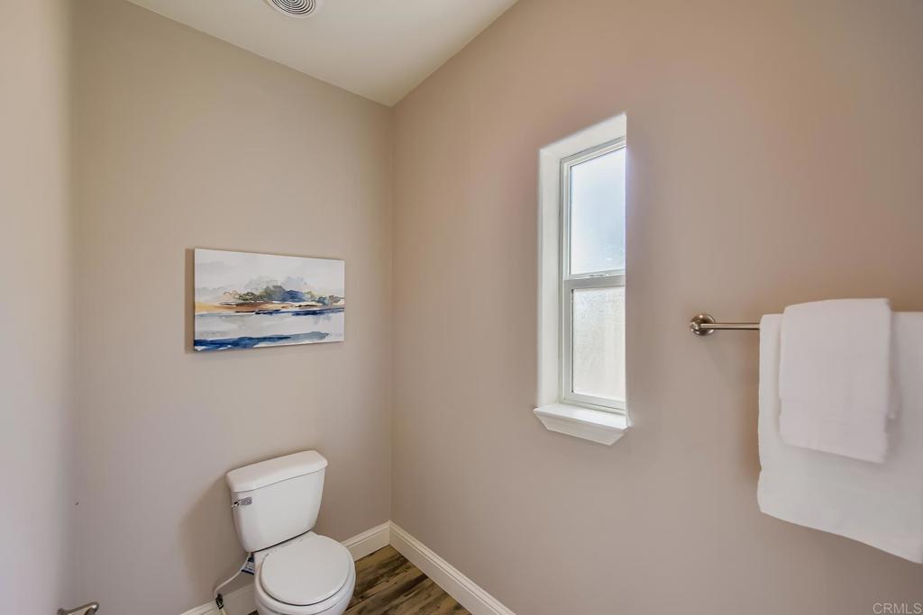 28720 North Twin Oaks Valley Road Vista, CA 92084 - Photo 32 of 66 a white toilet sitting next to a white walls