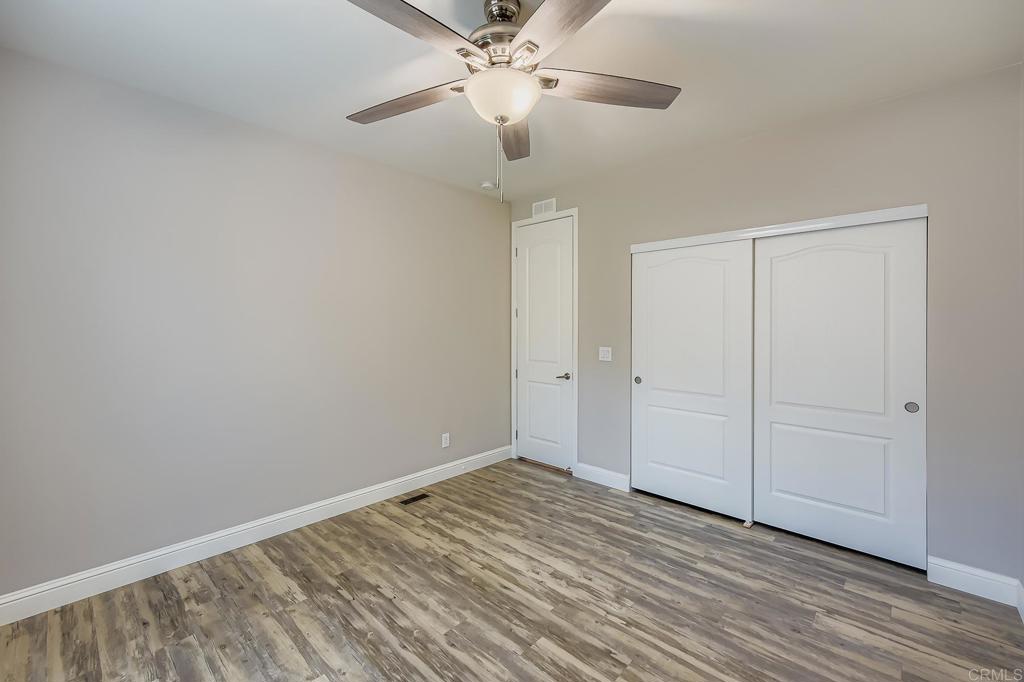 28720 North Twin Oaks Valley Road Vista, CA 92084 - Photo 35 of 66 a view of an empty room with wooden floor