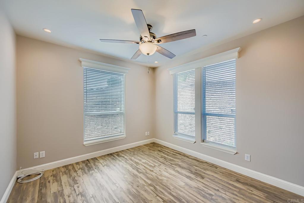 28720 North Twin Oaks Valley Road Vista, CA 92084 - Photo 42 of 66 wooden floor in an empty room with a window