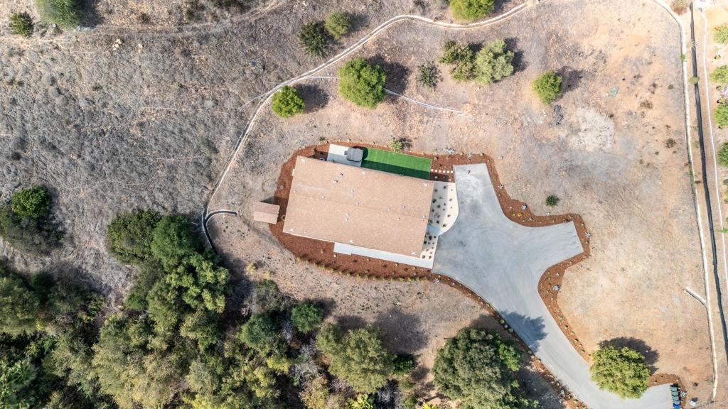 28720 North Twin Oaks Valley Road Vista, CA 92084 - Photo 62 of 66 an aerial view of a house with a yard and a garden