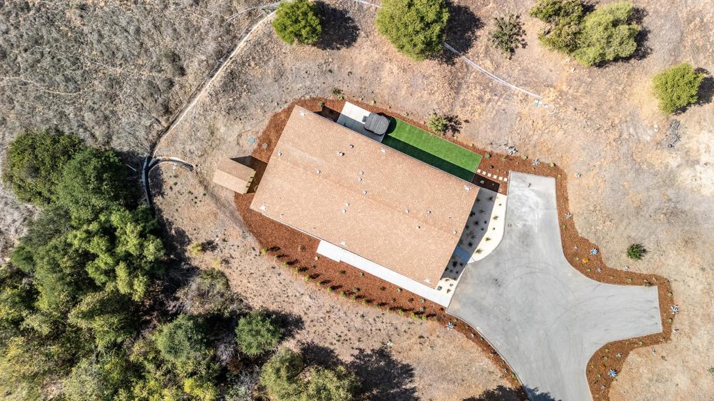 28720 North Twin Oaks Valley Road Vista, CA 92084 - Photo 64 of 66 an aerial view of a house with a yard and wooden fence