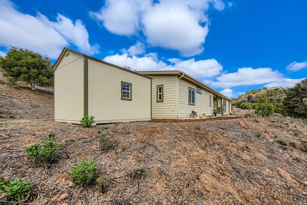 28720 North Twin Oaks Valley Road Vista, CA 92084 - Photo 9 of 66 a view of a house with a backyard