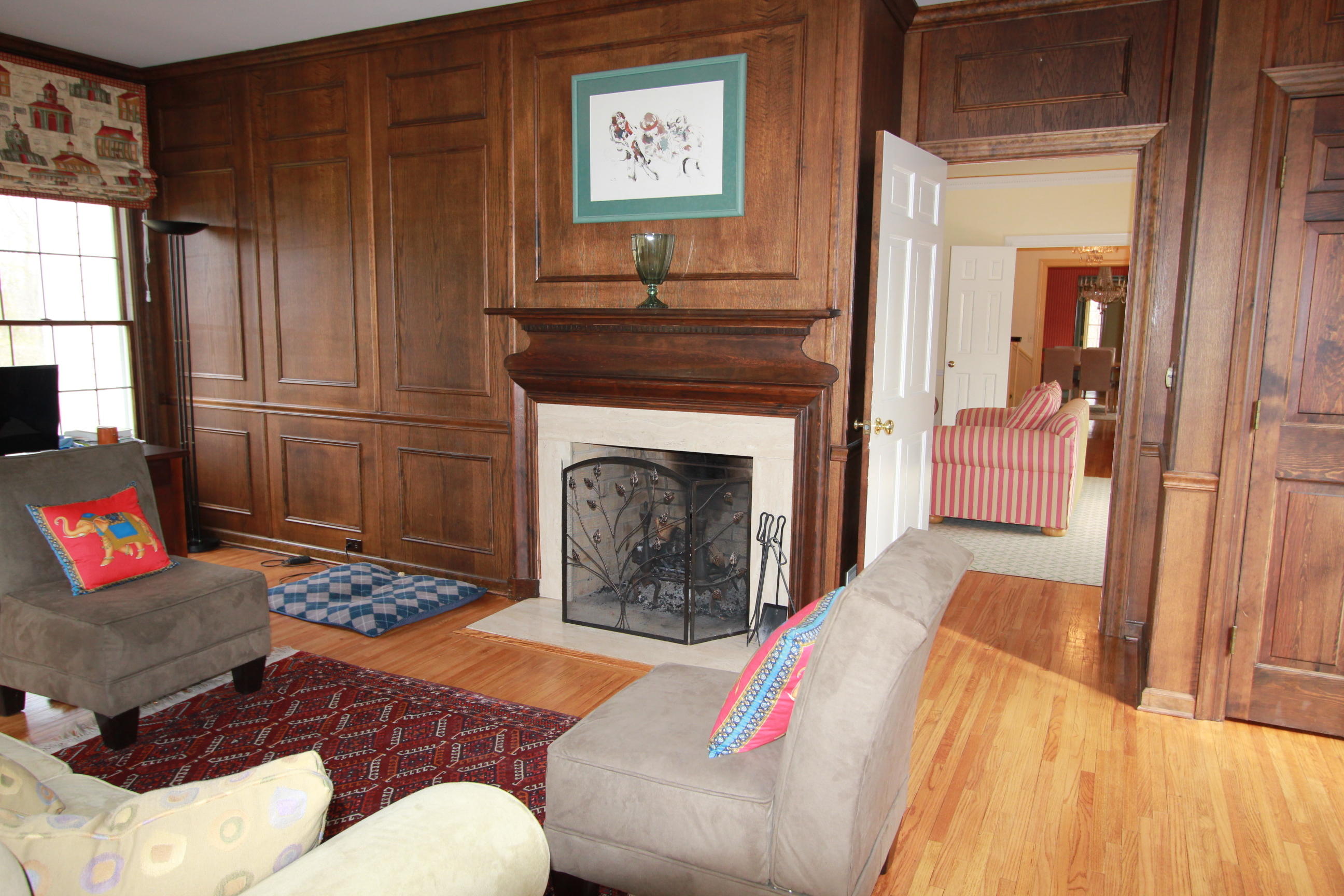 595 Smith Ridge Road New Canaan, CT 06840 - Photo 11 of 25 a living room with furniture and a fireplace