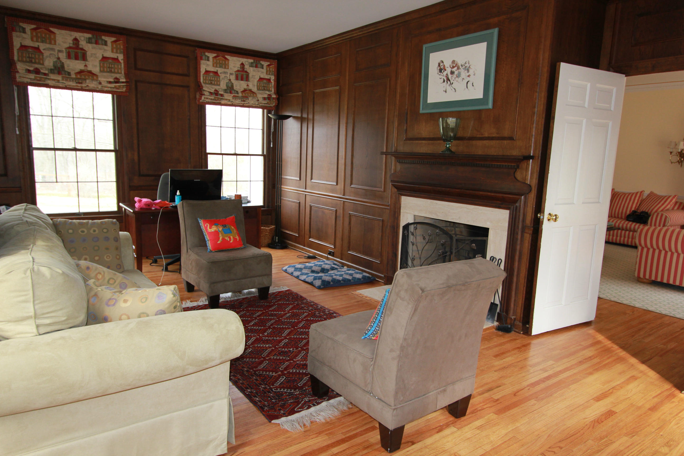 595 Smith Ridge Road New Canaan, CT 06840 - Photo 12 of 25 a living room with furniture and a fireplace