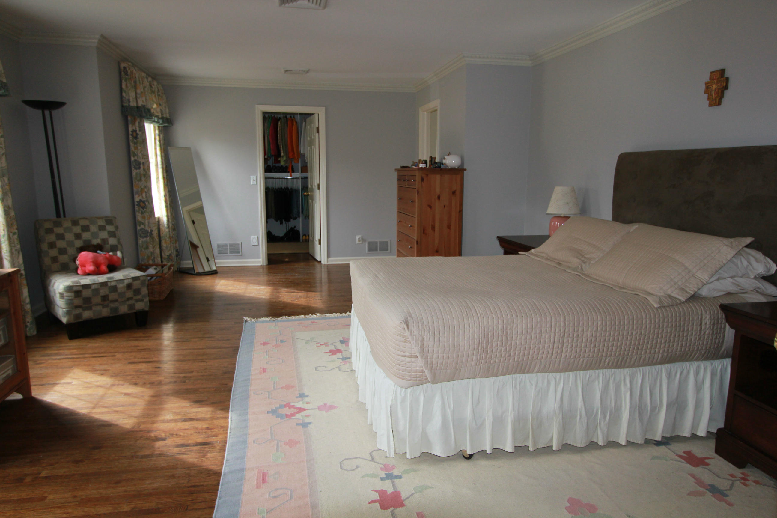 595 Smith Ridge Road New Canaan, CT 06840 - Photo 13 of 25 a bedroom with a bed and a flat tv screen on the dresser