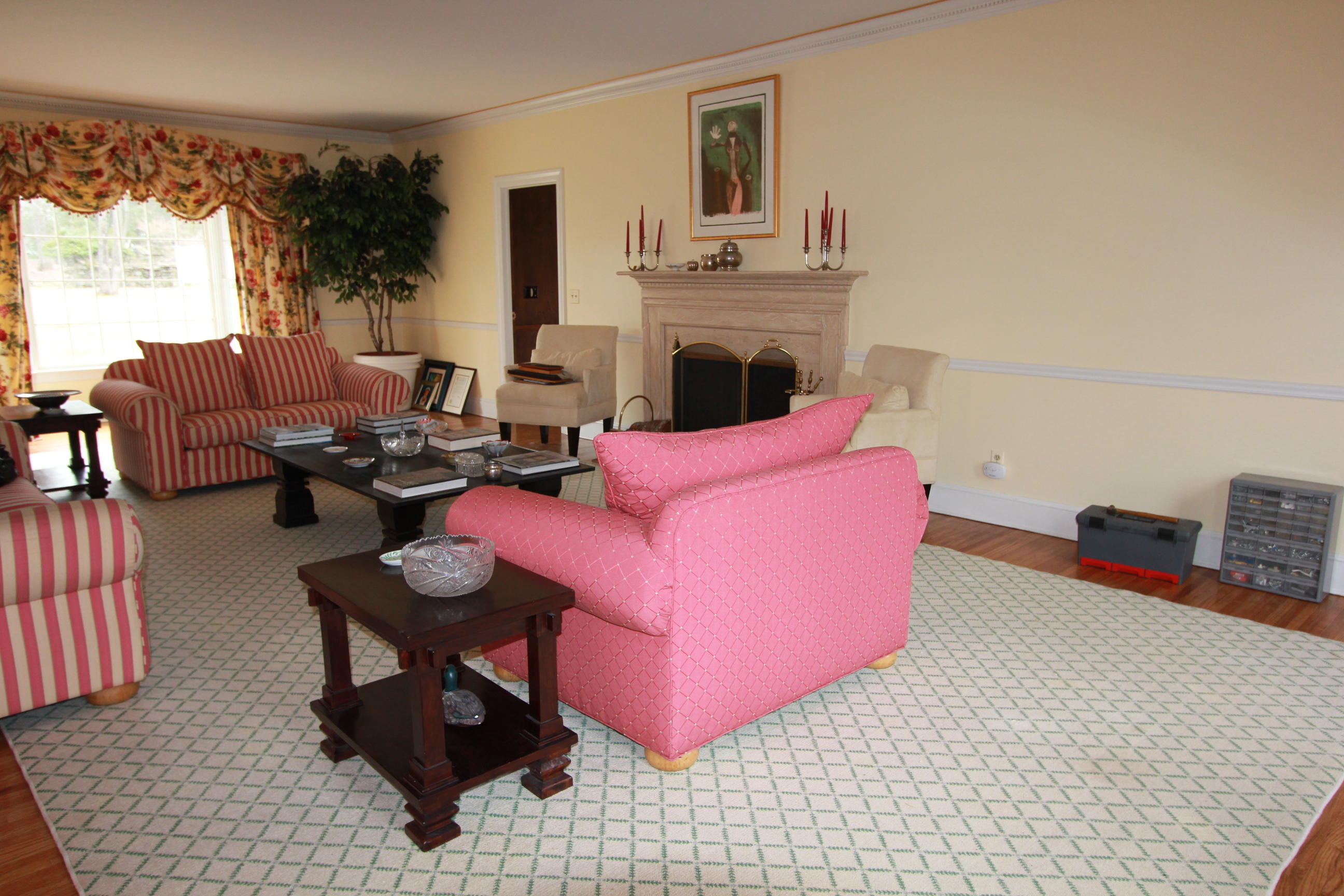 595 Smith Ridge Road New Canaan, CT 06840 - Photo 4 of 25 a living room with furniture a fireplace and a flat screen tv