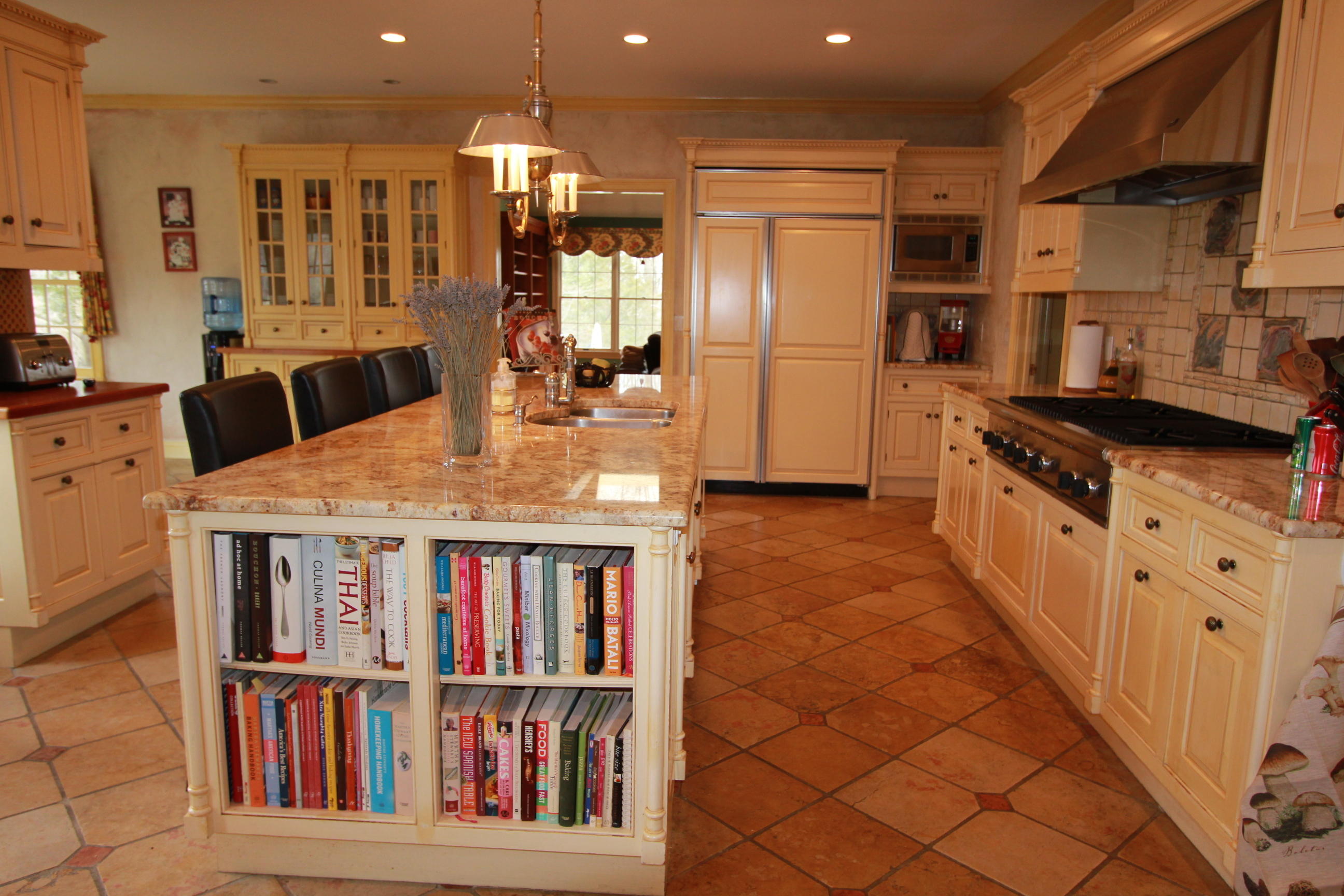595 Smith Ridge Road New Canaan, CT 06840 - Photo 6 of 25 a kitchen with stainless steel appliances granite countertop a refrigerator and a stove