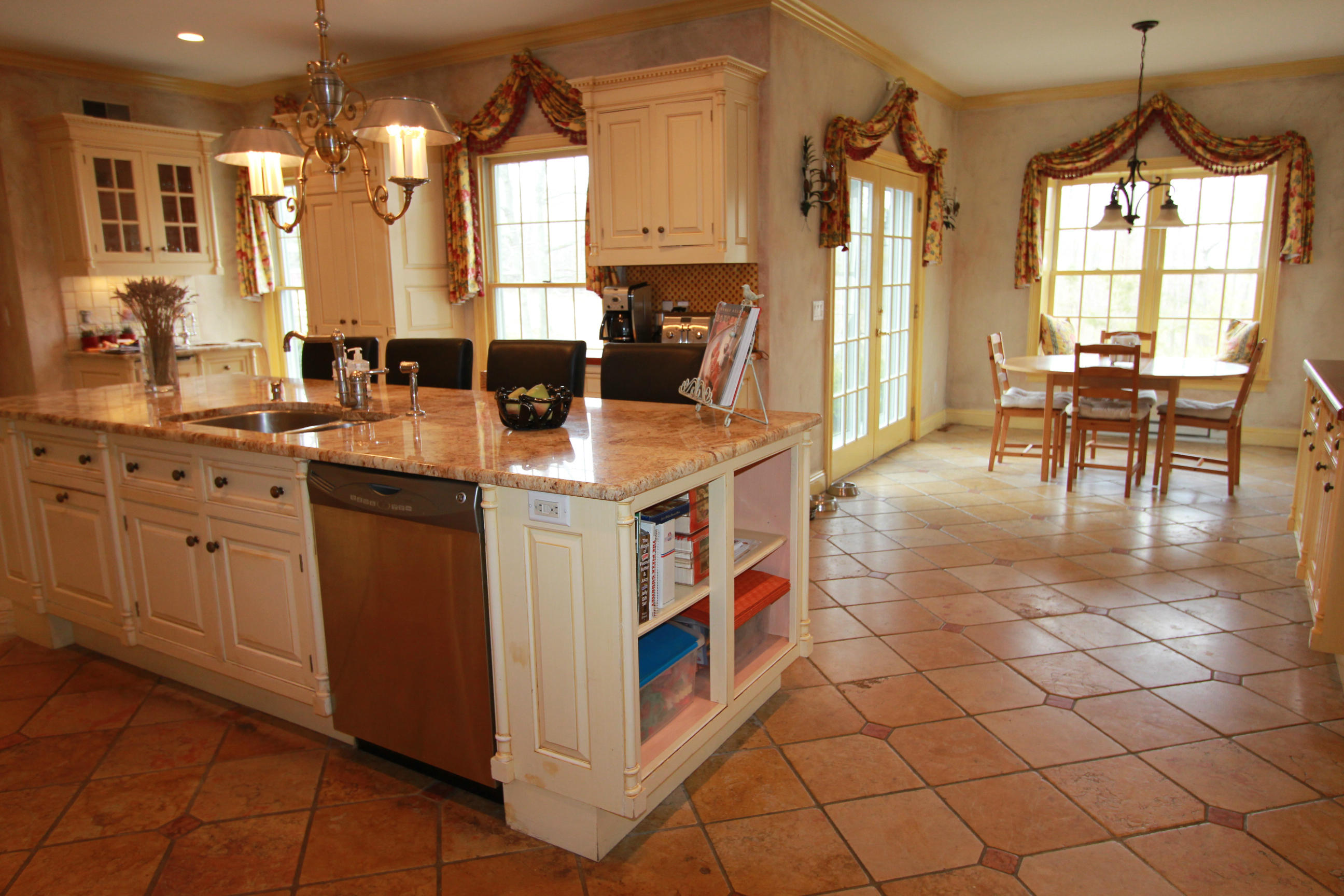 595 Smith Ridge Road New Canaan, CT 06840 - Photo 7 of 25 a kitchen with stainless steel appliances granite countertop a sink and cabinets
