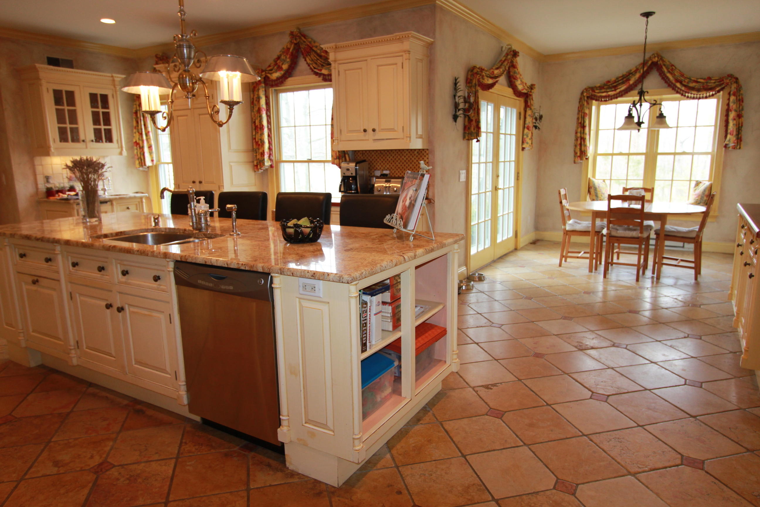595 Smith Ridge Road New Canaan, CT 06840 - Photo 8 of 25 a kitchen with stainless steel appliances granite countertop a sink and a refrigerator