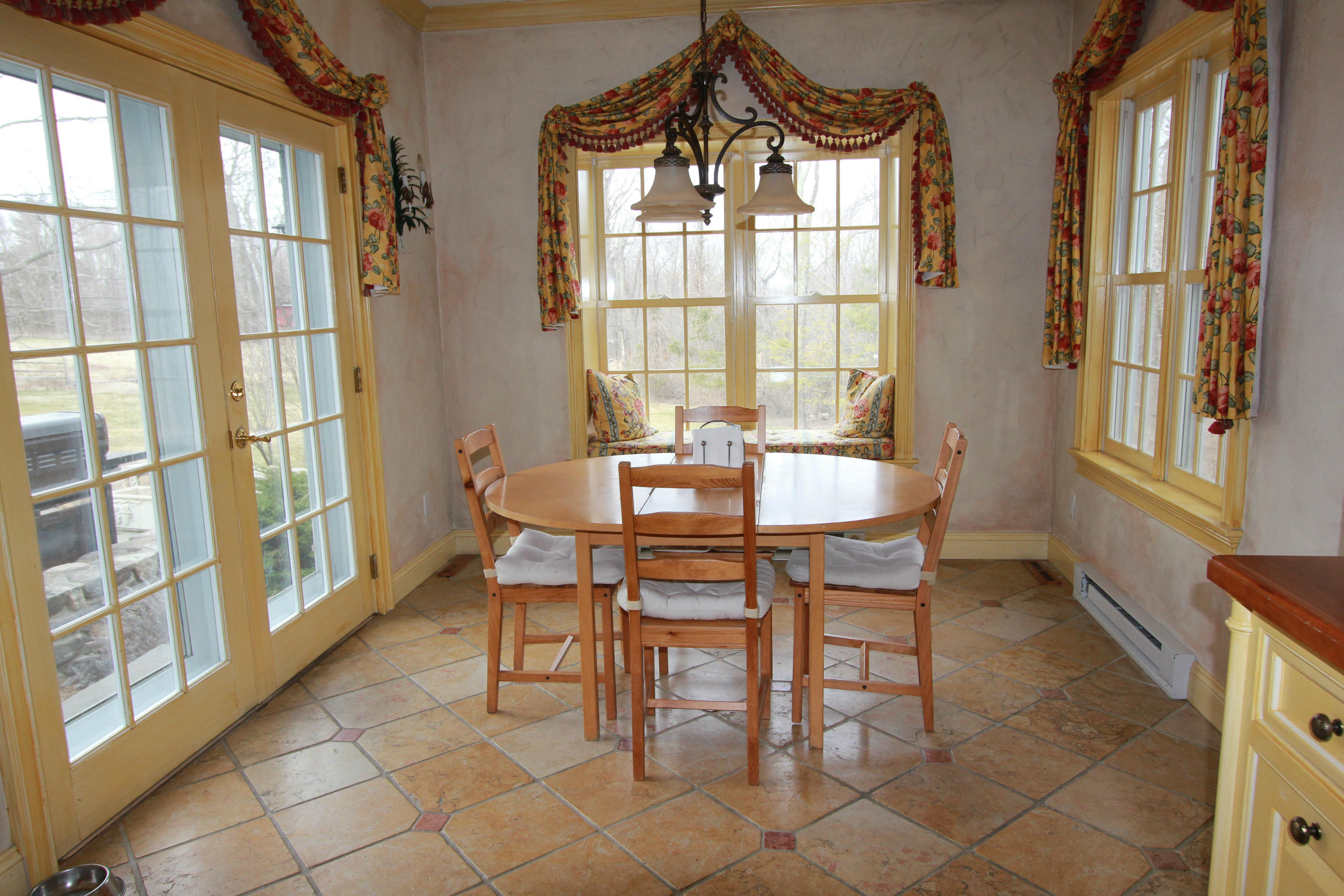 595 Smith Ridge Road New Canaan, CT 06840 - Photo 9 of 25 a dining room with furniture and window