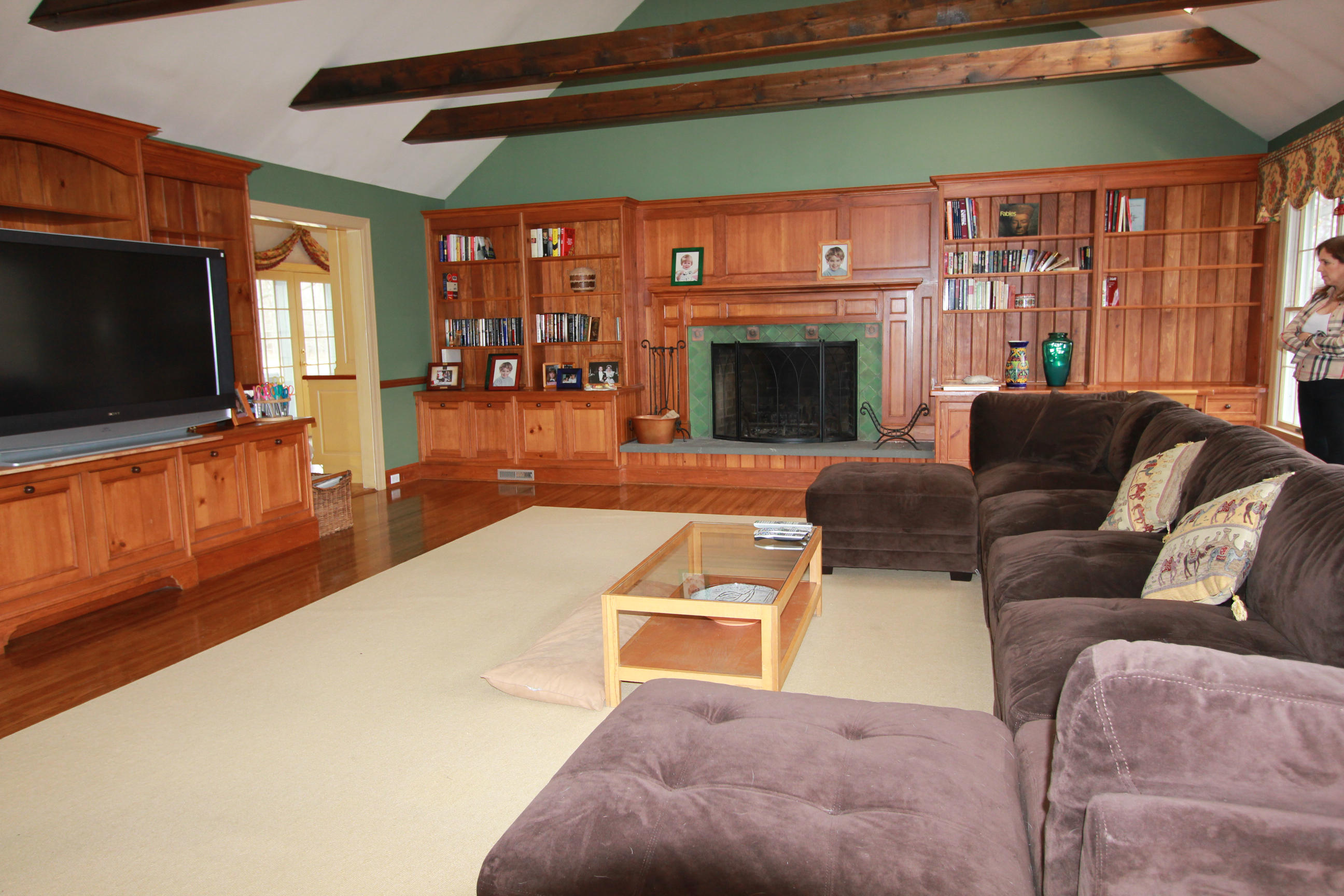 595 Smith Ridge Road New Canaan, CT 06840 - Photo 10 of 25 a living room with furniture and a flat screen tv