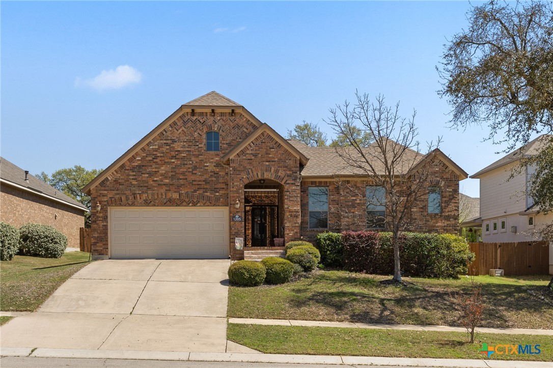 1205 Winding Way Drive Georgetown, TX 78628 - Photo 1 of 39 The home has a 3 car garage and brick veneer