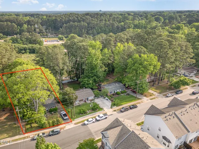 a backyard of a house with yard fountain and outdoor seating