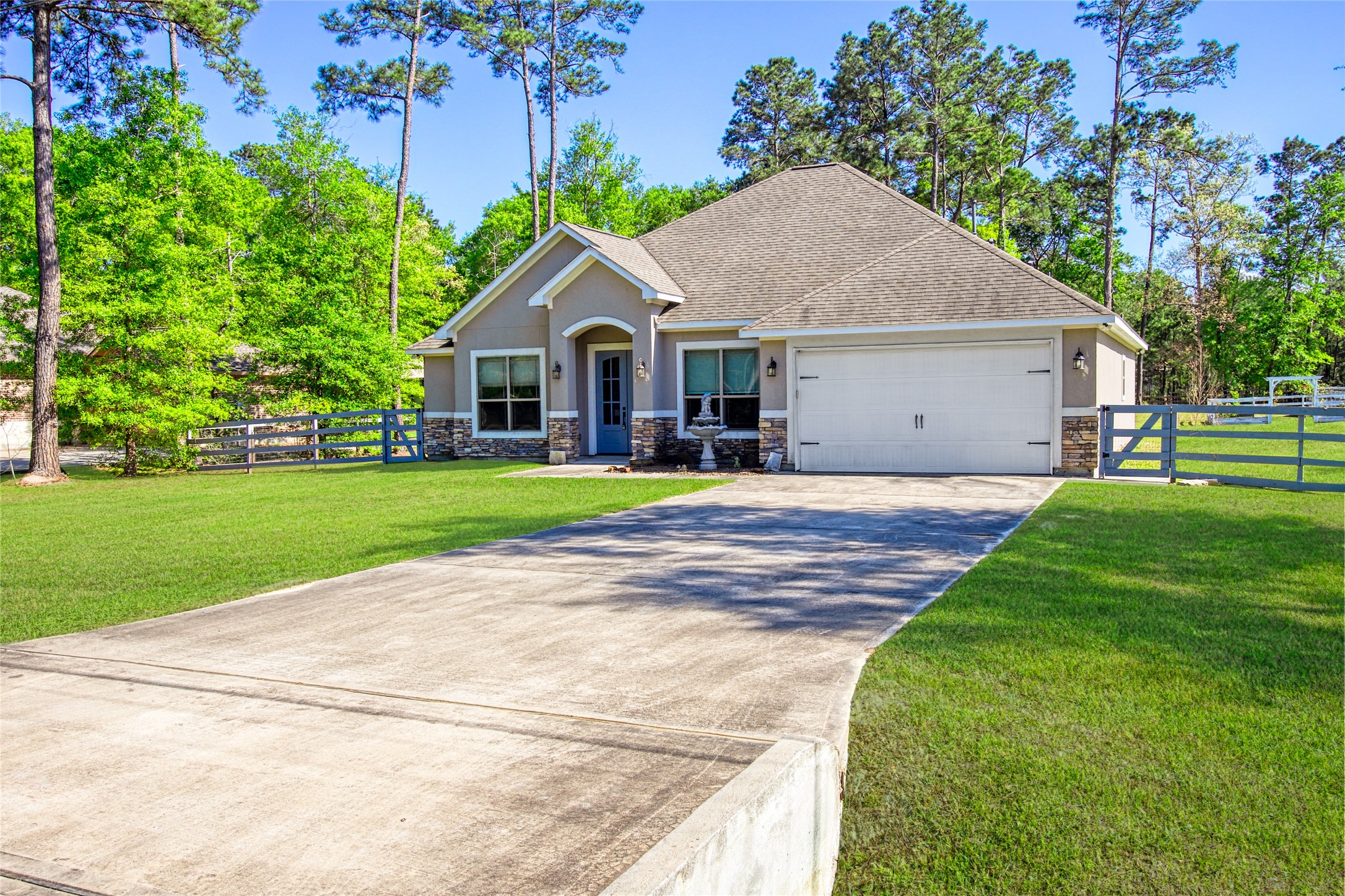 27684 Rio Blanco Drive Splendora, TX 77372 - Photo 2 of 31 a front view of house with yard and green space