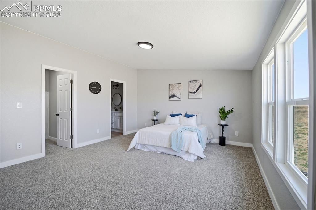 35125 Book Road Yoder, CO 80864 - Photo 9 of 45 a bed room with a bed and a window