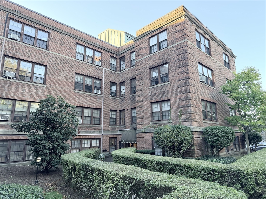 12 Kilsyth Terrace, Unit 11 Boston, MA 02135 - Photo 2 of 12 a front view of a building with garden