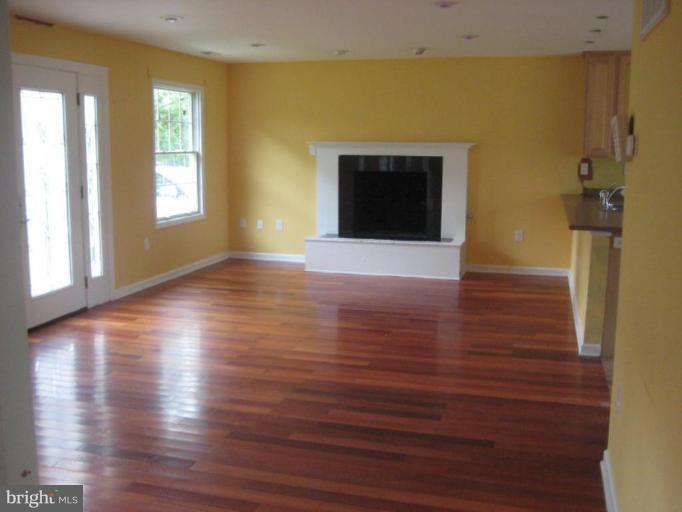 107 North Sycamore Road Sterling, VA 20164 - Photo 5 of 10 Living room with fireplace