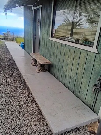 a view of balcony with wooden floor