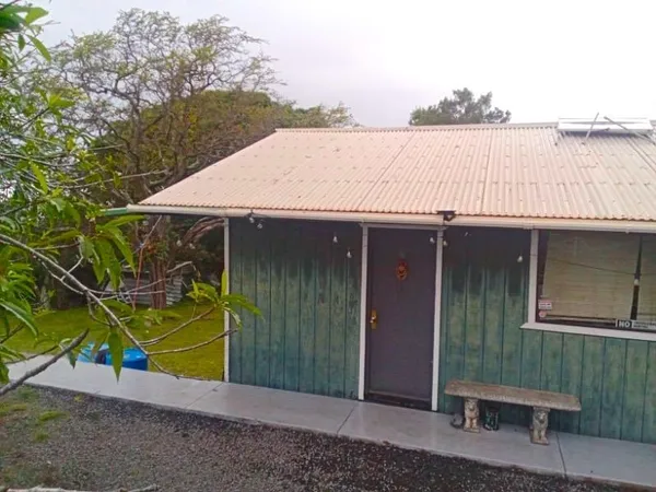a view of a house with backyard and lake view