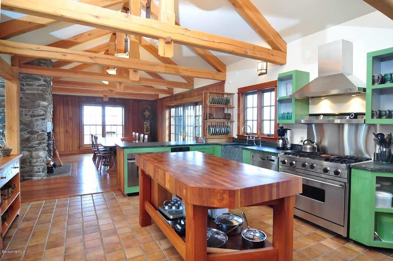 381 Leonhardt Road Becket, MA 01223 - Photo 12 of 47 a large kitchen with stainless steel appliances granite countertop a stove and a view of living room