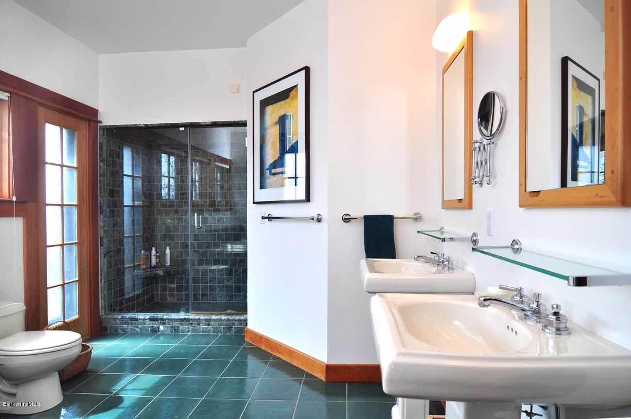 381 Leonhardt Road Becket, MA 01223 - Photo 17 of 47 a bathroom with a sink a toilet and shower