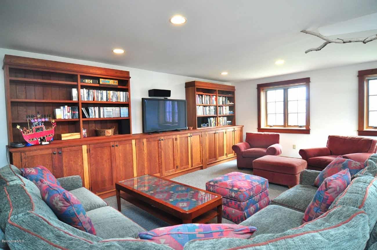 381 Leonhardt Road Becket, MA 01223 - Photo 23 of 47 a living room with furniture window and book shelf