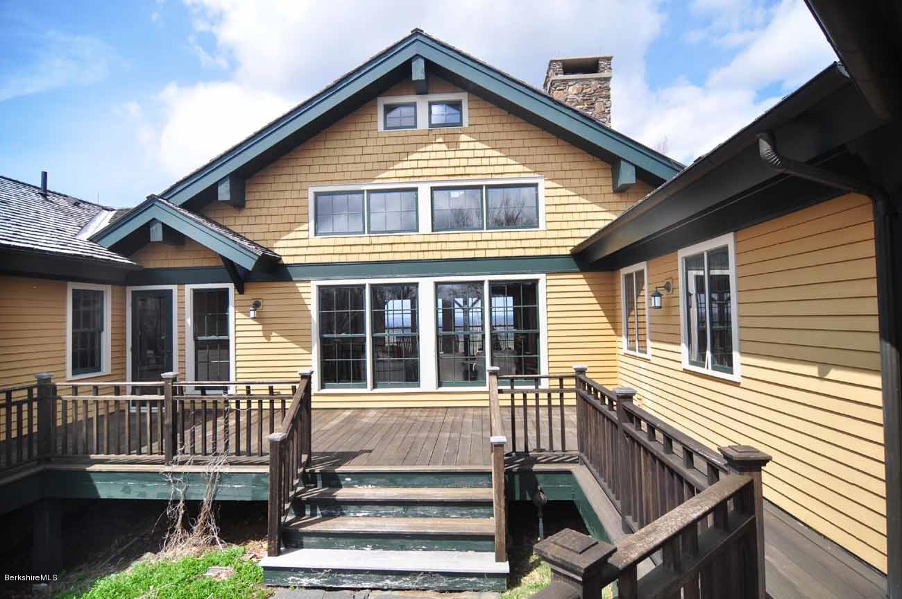 381 Leonhardt Road Becket, MA 01223 - Photo 24 of 47 a view of a house with wooden deck and furniture