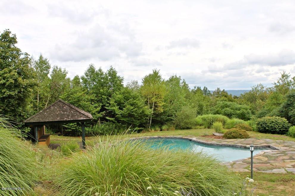 381 Leonhardt Road Becket, MA 01223 - Photo 25 of 47 a view of a swimming pool with an outdoor seating