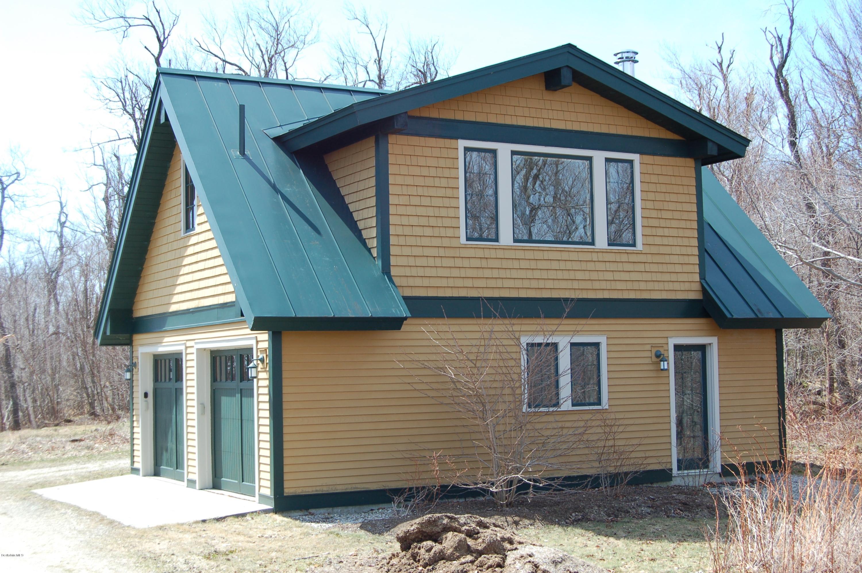 381 Leonhardt Road Becket, MA 01223 - Photo 28 of 47 a front view of a house with a yard