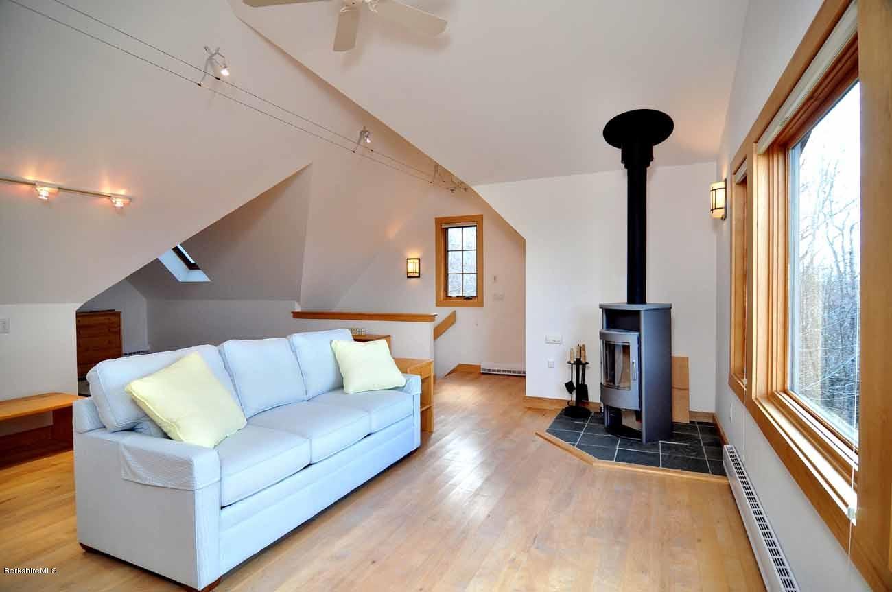 381 Leonhardt Road Becket, MA 01223 - Photo 29 of 47 a living room with furniture and a large window